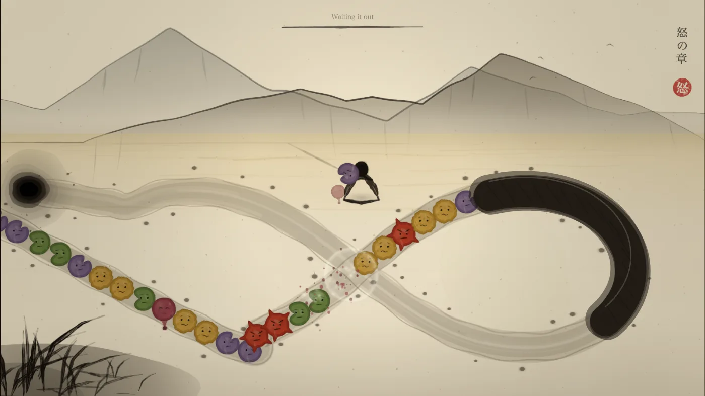 A figure-eight track under a mountain, orbs in five colours along it, a pale ring and red spatter where three have just cleared, and a black covered stretch on the right